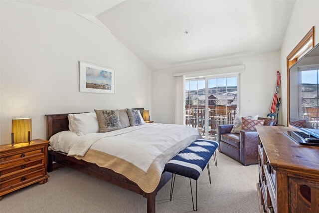 101 E Main St Unit 301, Frisco, CO 80443 - bedroom with light colored carpet, multiple windows, vaulted ceiling, and access to outside