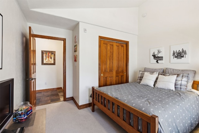 101 E Main St Unit 301, Frisco, CO 80443 - bedroom with a closet, baseboards, carpet, and lofted ceiling