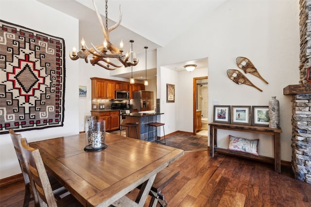 101 E Main St Unit 301, Frisco, CO 80443 - dining area with a chandelier, dark wood-style flooring, high vaulted ceiling, and baseboards