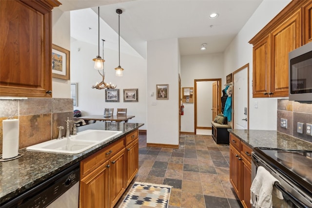 101 E Main St Unit 301, Frisco, CO 80443 - kitchen featuring a sink, stainless steel appliances, brown cabinetry, backsplash, and recessed lighting
