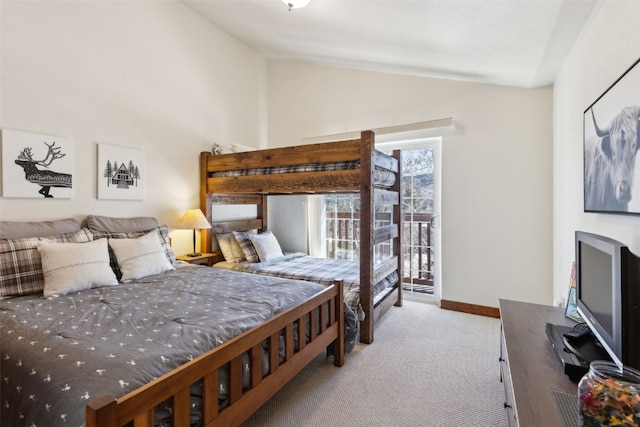 101 E Main St Unit 301, Frisco, CO 80443 - carpeted bedroom with lofted ceiling, access to exterior, and baseboards