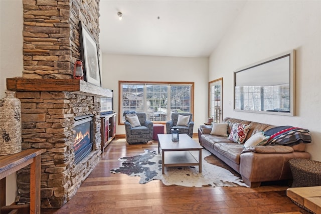 101 E Main St Unit 301, Frisco, CO 80443 - living area featuring a stone fireplace and wood-type flooring