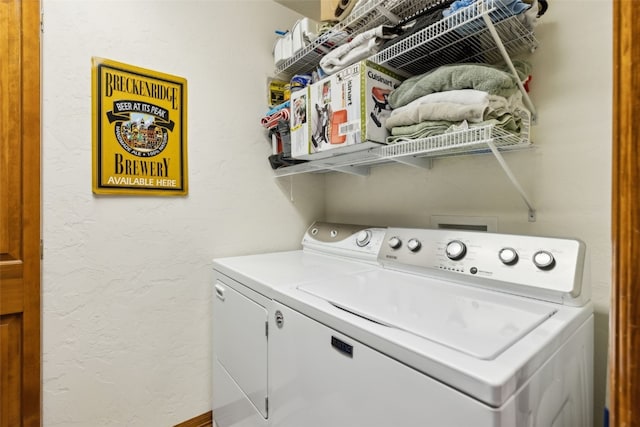 101 E Main St Unit 301, Frisco, CO 80443 - laundry area with washing machine and clothes dryer and a textured wall