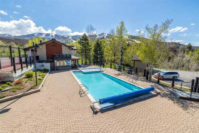 1655 Ranch Rd Unit 403, Steamboat Springs, CO 80487 - view of pool featuring a mountain view and a patio
