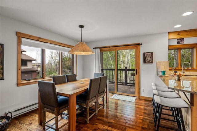 1655 Ranch Rd Unit 403, Steamboat Springs, CO 80487 - dining area with dark wood-style flooring, recessed lighting, and a baseboard radiator