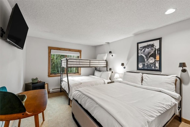 1655 Ranch Rd Unit 403, Steamboat Springs, CO 80487 - bedroom featuring a baseboard radiator, light colored carpet, a textured ceiling, and recessed lighting