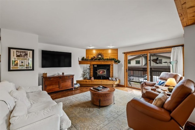 1655 Ranch Rd Unit 403, Steamboat Springs, CO 80487 - living room featuring a lit fireplace and wood finished floors