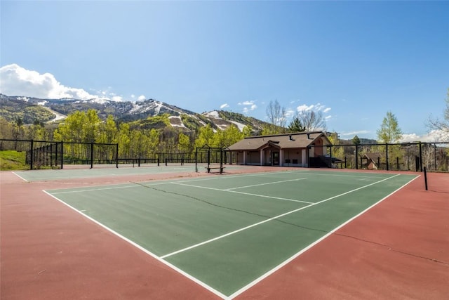 1655 Ranch Rd Unit 403, Steamboat Springs, CO 80487 - view of tennis court with community basketball court and a mountain view