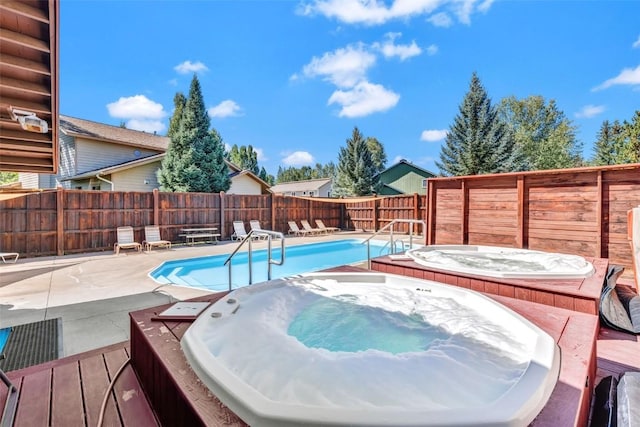 6 Sequoia Ct Unit 6, Steamboat Springs, CO 80487 - view of swimming pool featuring an outdoor hot tub, a fenced backyard, and a patio