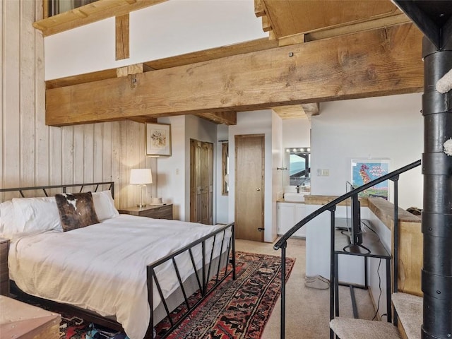 bedroom featuring carpet floors and wood walls