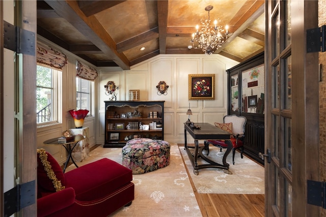 330 High Park Ct, Silverthorne, CO 80498 - living area with vaulted ceiling, wood finished floors, a notable chandelier, and a decorative wall