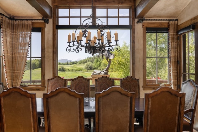 330 High Park Ct, Silverthorne, CO 80498 - dining space with a mountain view, a chandelier, and beamed ceiling