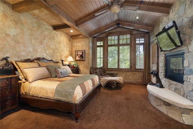 330 High Park Ct, Silverthorne, CO 80498 - carpeted bedroom with wooden ceiling, a stone fireplace, and vaulted ceiling with beams