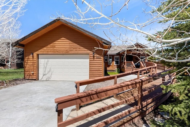 view of front of home featuring driveway and a garage