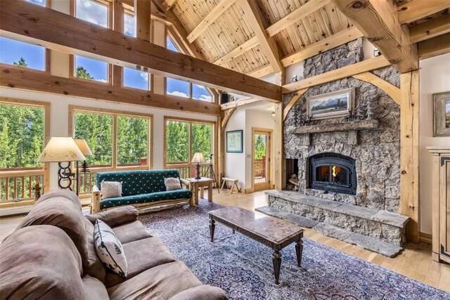 70 County Road 26, Twin Lakes, CO 81251 - living room with beamed ceiling, wood finished floors, a wealth of natural light, and high vaulted ceiling