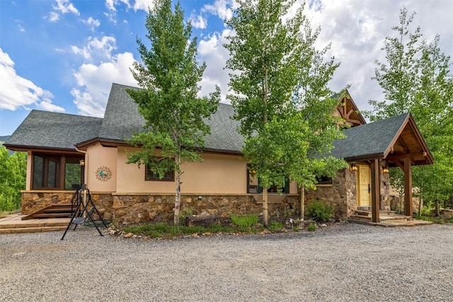 70 County Road 26, Twin Lakes, CO 81251 - view of front facade with stucco siding, stone siding, and a shingled roof