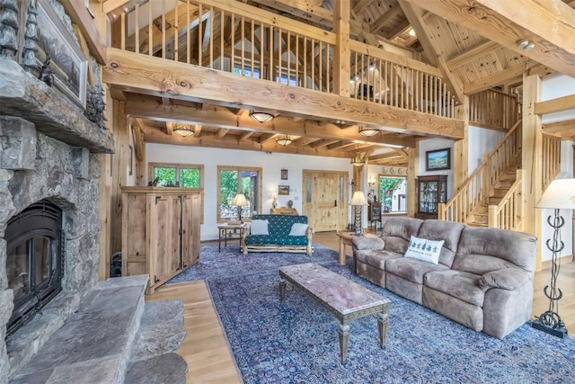 70 County Road 26, Twin Lakes, CO 81251 - living room with high vaulted ceiling, stairway, wood finished floors, wood ceiling, and beamed ceiling
