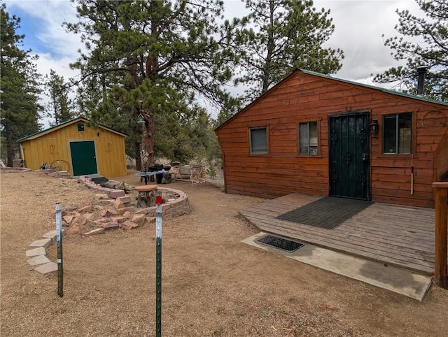 exterior space with an outdoor structure and a deck