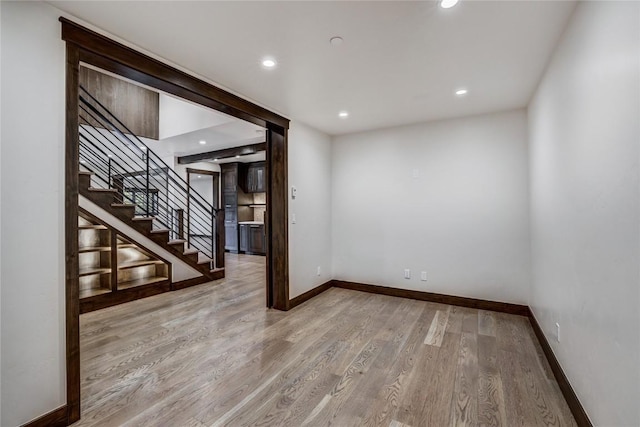 77 E Trade Ct, Keystone, CO 80435 - empty room featuring wood finished floors, baseboards, stairs, and recessed lighting