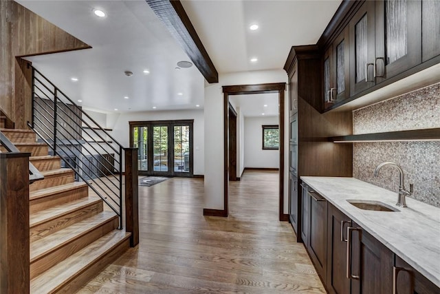 77 E Trade Ct, Keystone, CO 80435 - bar area with a sink, tasteful backsplash, light wood-type flooring, recessed lighting, and stairway