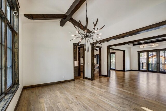 77 E Trade Ct, Keystone, CO 80435 - spare room with a chandelier, baseboards, and light wood-type flooring