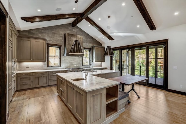 77 E Trade Ct, Keystone, CO 80435 - kitchen featuring a sink, an island with sink, light wood finished floors, healthy amount of natural light, and recessed lighting