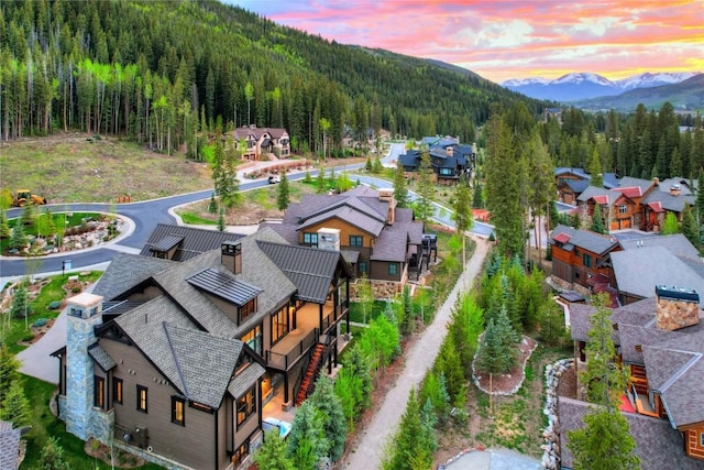 77 E Trade Ct, Keystone, CO 80435 - aerial view of residential area with a mountainous background and a heavily wooded area