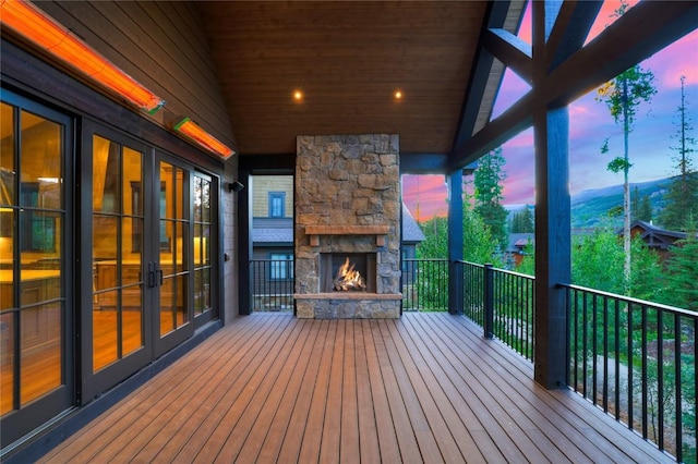 77 E Trade Ct, Keystone, CO 80435 - wooden deck with an outdoor stone fireplace
