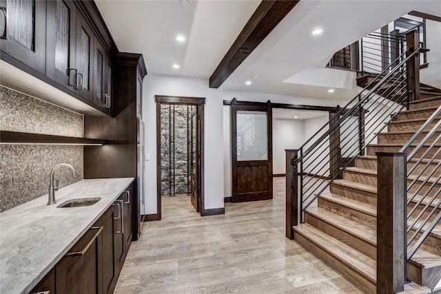 77 E Trade Ct, Keystone, CO 80435 - bar with a barn door, backsplash, a sink, stairway, and recessed lighting