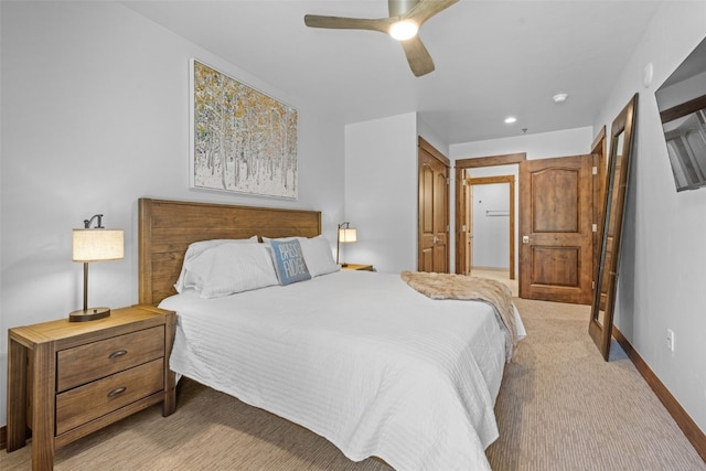 carpeted bedroom featuring a closet and ceiling fan