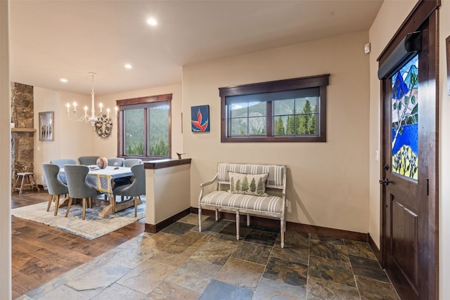 67 Outpost Dr Unit 67, Keystone, CO 80435 - foyer entrance featuring stone tile floors, a chandelier, and recessed lighting