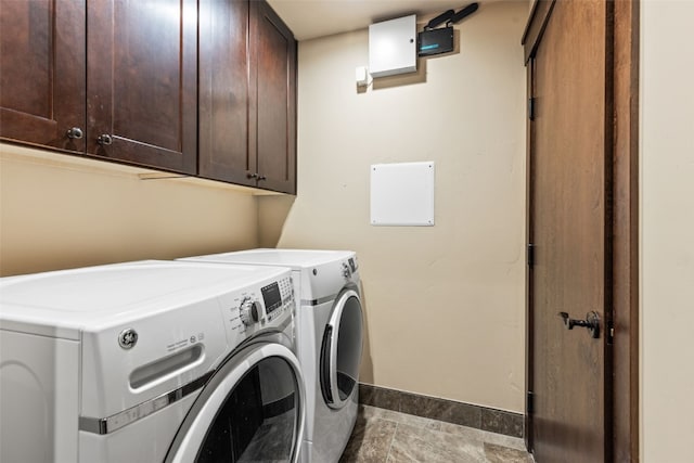 67 Outpost Dr Unit 67, Keystone, CO 80435 - laundry area featuring washer and dryer and cabinet space