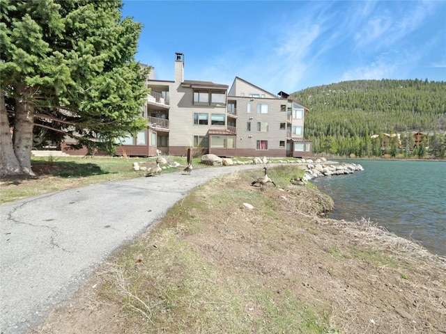 22280 US Highway 6 Unit 1717, Keystone, CO 80435 - view of building exterior featuring a wooded view and a water view