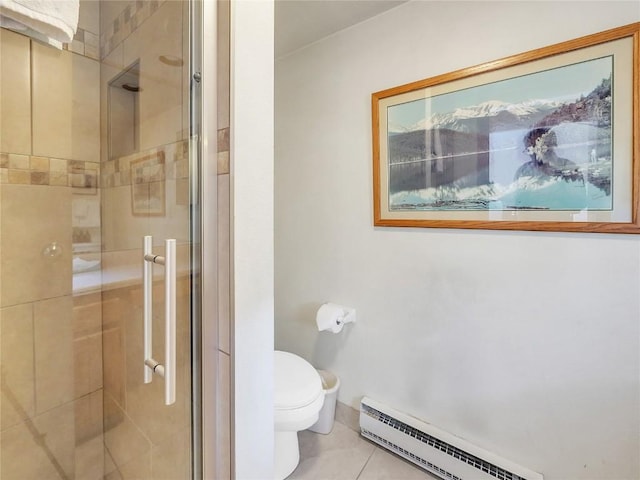 22280 US Highway 6 Unit 1717, Keystone, CO 80435 - bathroom featuring a baseboard heating unit, toilet, a shower stall, and tile patterned flooring