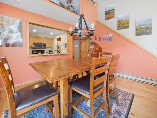 22280 US Highway 6 Unit 1717, Keystone, CO 80435 - dining room with a chandelier, recessed lighting, light wood-style flooring, and baseboards