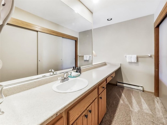 22280 US Highway 6 Unit 1717, Keystone, CO 80435 - bathroom with baseboard heating, vanity, and baseboards