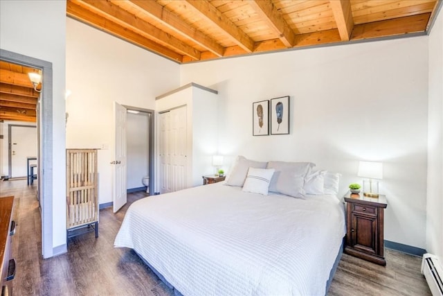 8300 Ryan Gulch Rd Unit F306, Silverthorne, CO 80498 - bedroom featuring a baseboard radiator, wood ceiling, beam ceiling, wood finished floors, and a closet