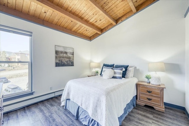 8300 Ryan Gulch Rd Unit F306, Silverthorne, CO 80498 - bedroom featuring wood ceiling, a baseboard radiator, wood finished floors, and baseboards