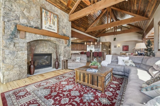 28 Tieze Ln, Keystone, CO 80435 - living room featuring high vaulted ceiling, hardwood / wood-style floors, a fireplace, and beamed ceiling
