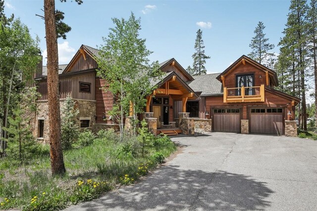 28 Tieze Ln, Keystone, CO 80435 - rustic home featuring stone siding, driveway, a garage, and board and batten siding