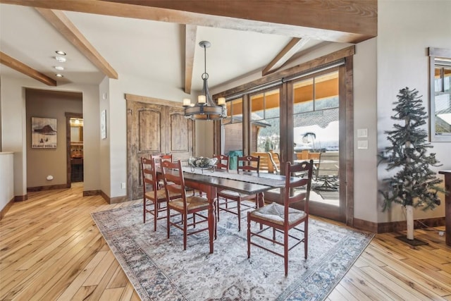 28 Tieze Ln, Keystone, CO 80435 - dining room with a chandelier, light wood-style floors, and beamed ceiling