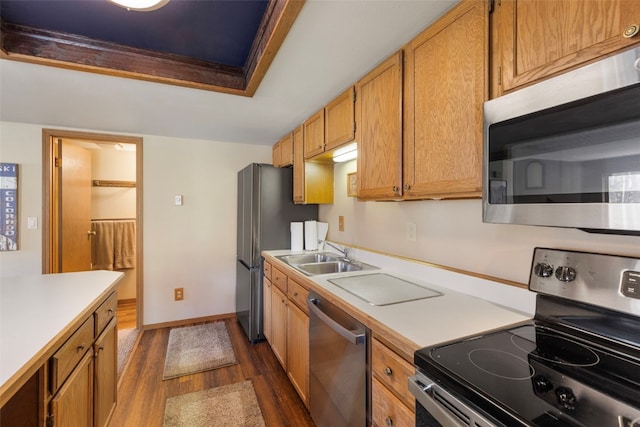 160 Creekside Dr Unit 3, Frisco, CO 80443 - kitchen with appliances with stainless steel finishes, a sink, dark wood-type flooring, light countertops, and baseboards