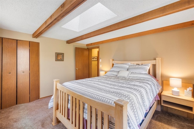 160 Creekside Dr Unit 3, Frisco, CO 80443 - carpeted bedroom with beamed ceiling, a closet, and a skylight