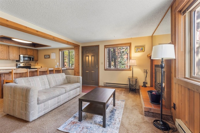 160 Creekside Dr Unit 3, Frisco, CO 80443 - living area featuring a baseboard heating unit, a baseboard radiator, a textured ceiling, and light carpet