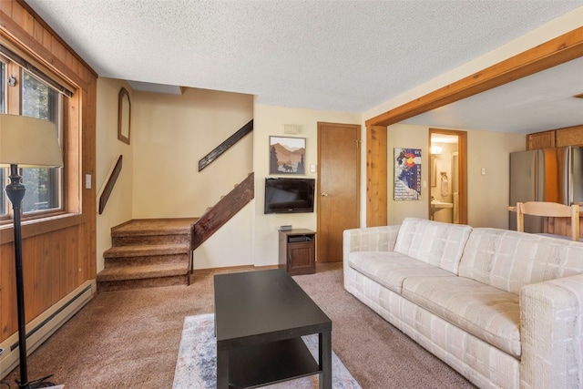 160 Creekside Dr Unit 3, Frisco, CO 80443 - living area featuring a baseboard heating unit, carpet flooring, stairway, a textured ceiling, and baseboards