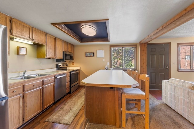 160 Creekside Dr Unit 3, Frisco, CO 80443 - kitchen with appliances with stainless steel finishes, healthy amount of natural light, a breakfast bar area, and light countertops