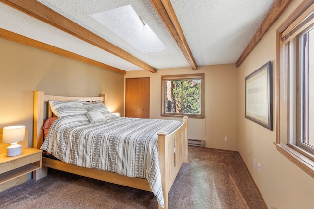 160 Creekside Dr Unit 3, Frisco, CO 80443 - bedroom featuring a baseboard heating unit, carpet, beamed ceiling, a textured ceiling, and a skylight
