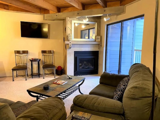 carpeted living area featuring wooden ceiling, beam ceiling, and a fireplace