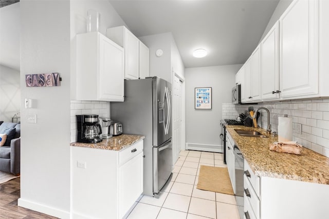 821 Pitkin St Unit 8, Frisco, CO 80443 - kitchen with a sink, stainless steel appliances, backsplash, and baseboards