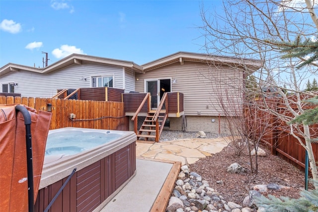 821 Pitkin St Unit 8, Frisco, CO 80443 - back of property featuring a hot tub and a wooden deck